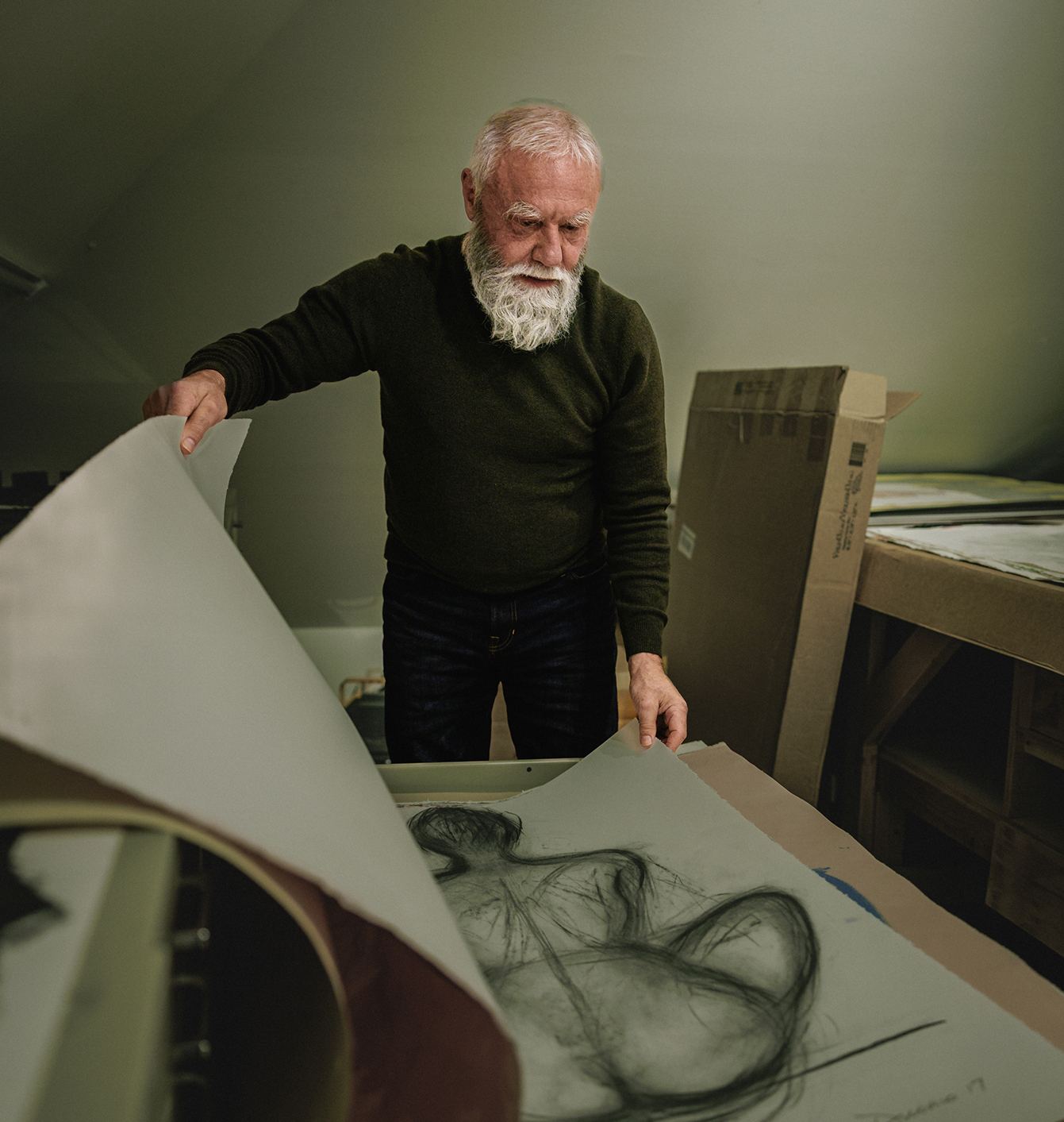 Emilio reviewing artwork